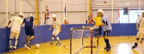 An indoor Football Skating match in progress in an ordinary sports hall