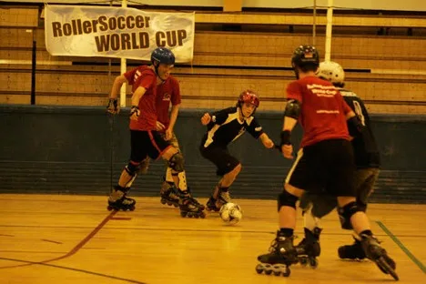 Adult players competing on inline skates during a RollerSoccer competition