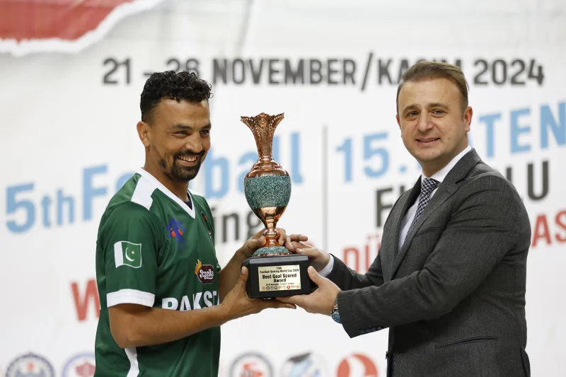 Ali Arshad of Pakistan, winner of the BEST GOAL SCORER award of the Football Skating World Cup 2024, holding the trophy