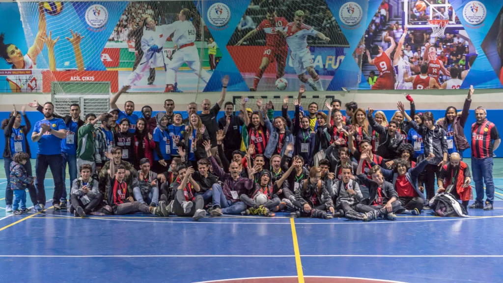 Participants of an international Football Skating coaching course together on court