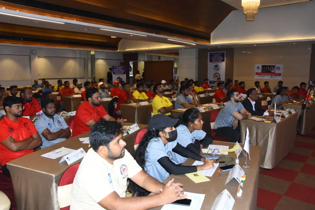 Participants of an international coaching seminar seated in a classroom session