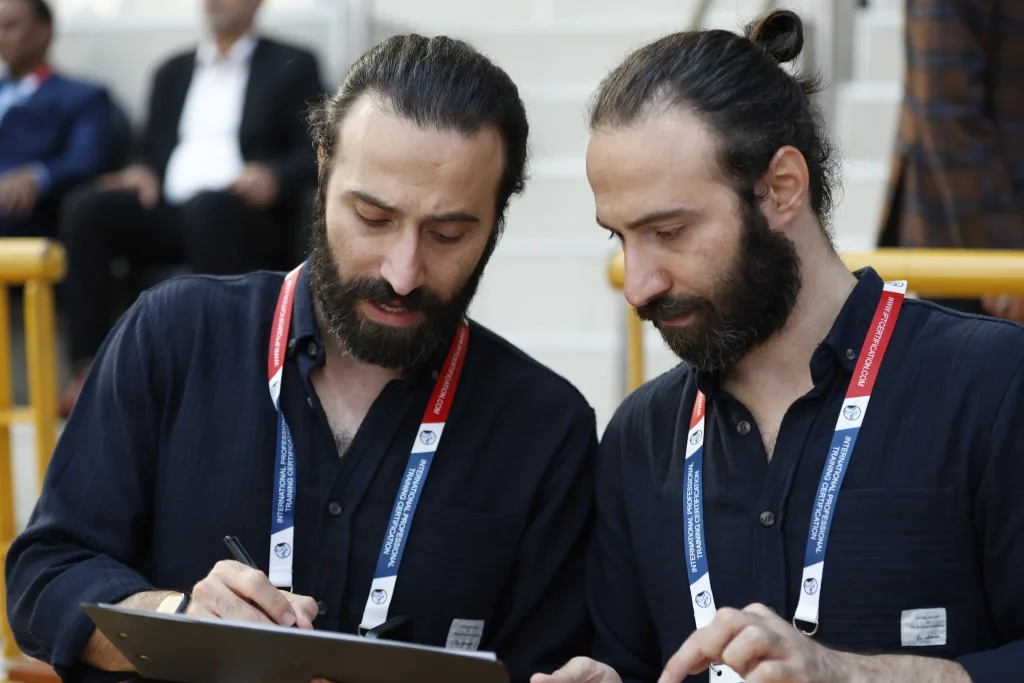 Competition officials recording match information during the Football Skating World Cup