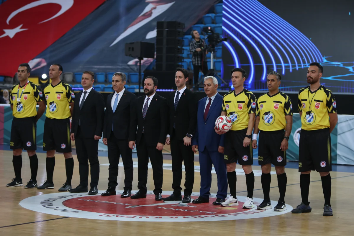 The FIFS match officials and international representatives lined up on court with the official match ball before a Football Skating World Cup match in Trabzon