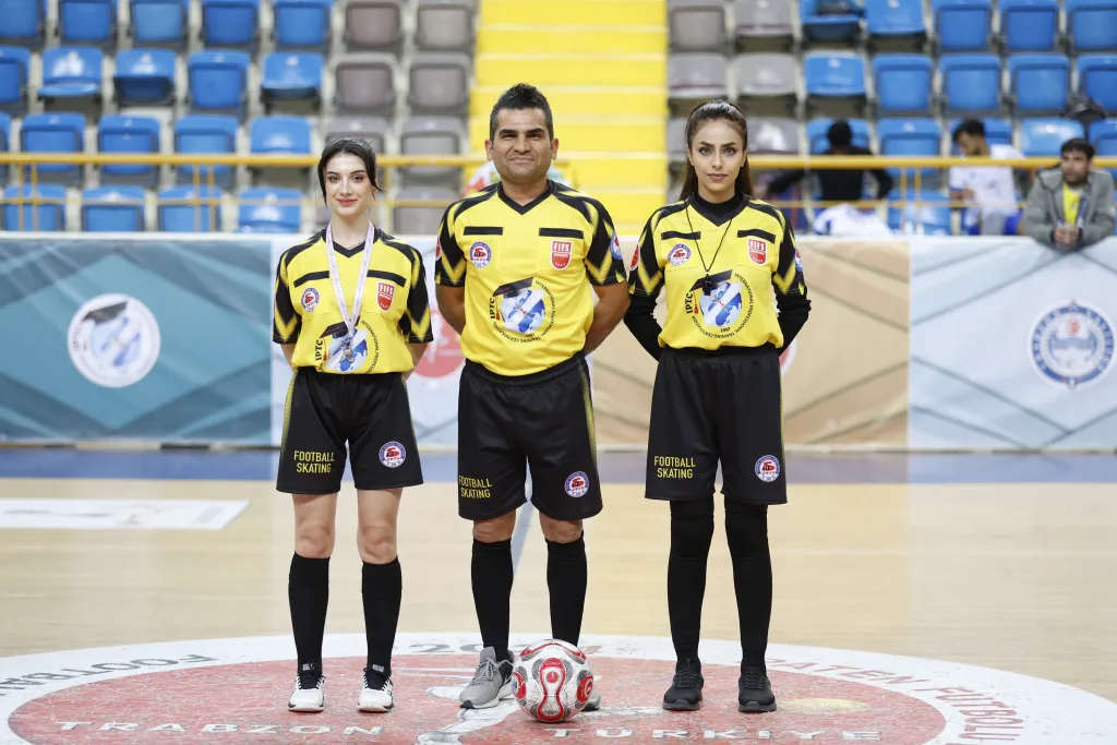 A mixed international refereeing team before a Football Skating match