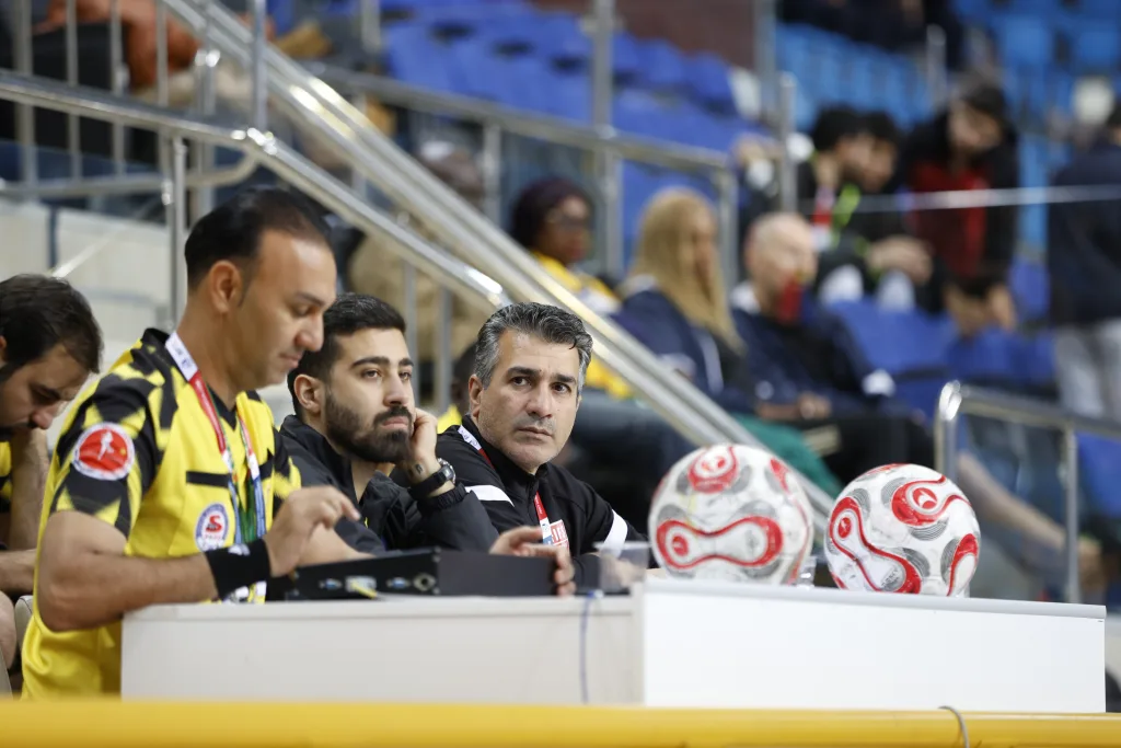 Match officials at the technical table with the official match balls prepared