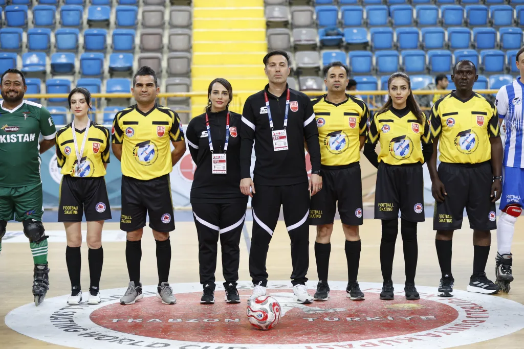FIFS referees lined up on court before a match