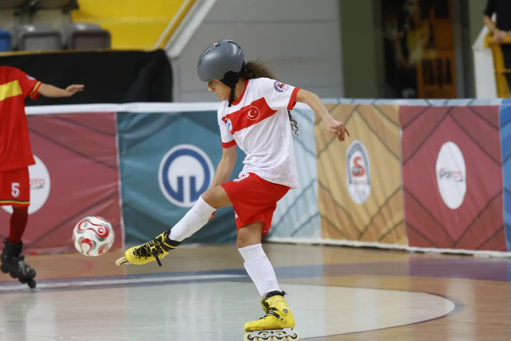 School-age players competing as a team in a Football Skating match