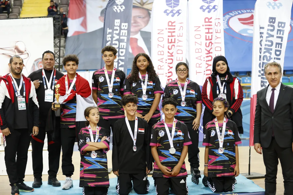 Junior medallists with their national representatives on the podium in Trabzon