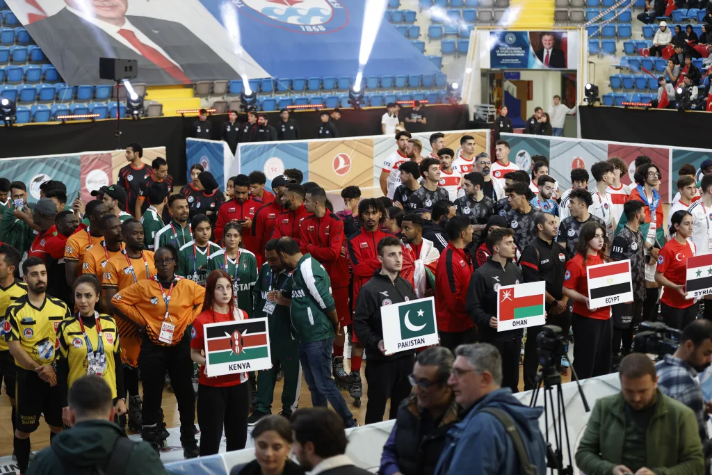 National delegations from five continents lined up with their flags at the Football Skating World Cup