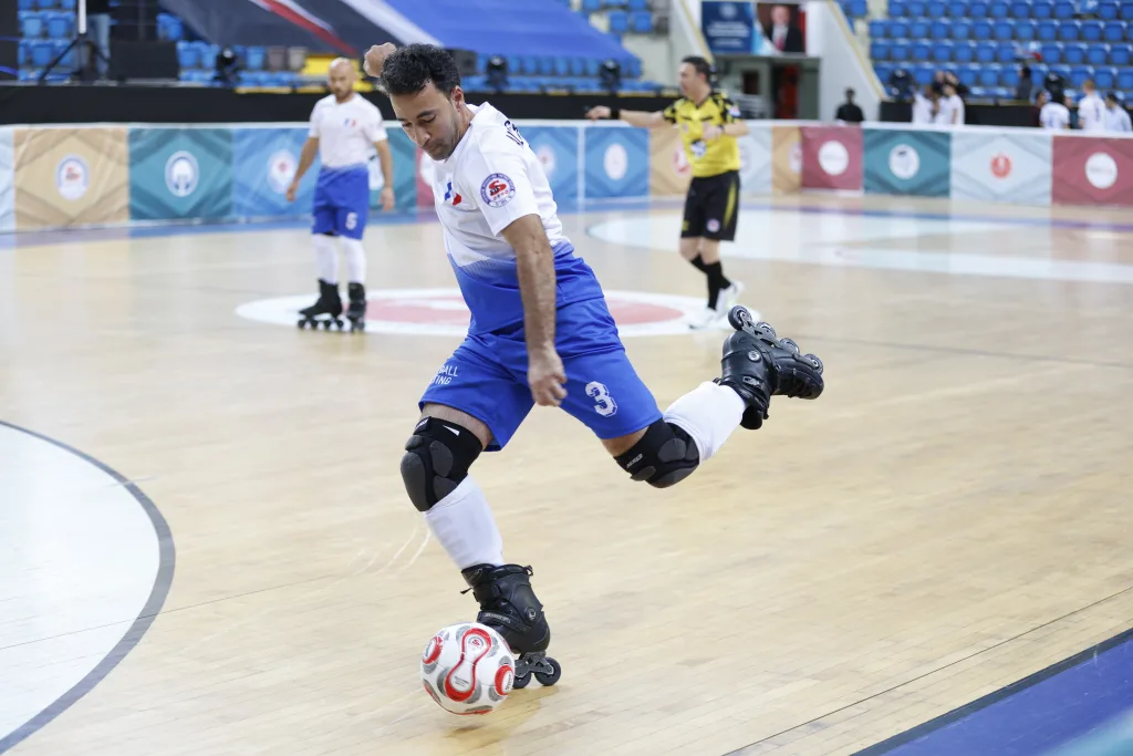 A player controlling the ball on inline skates during World Cup competition