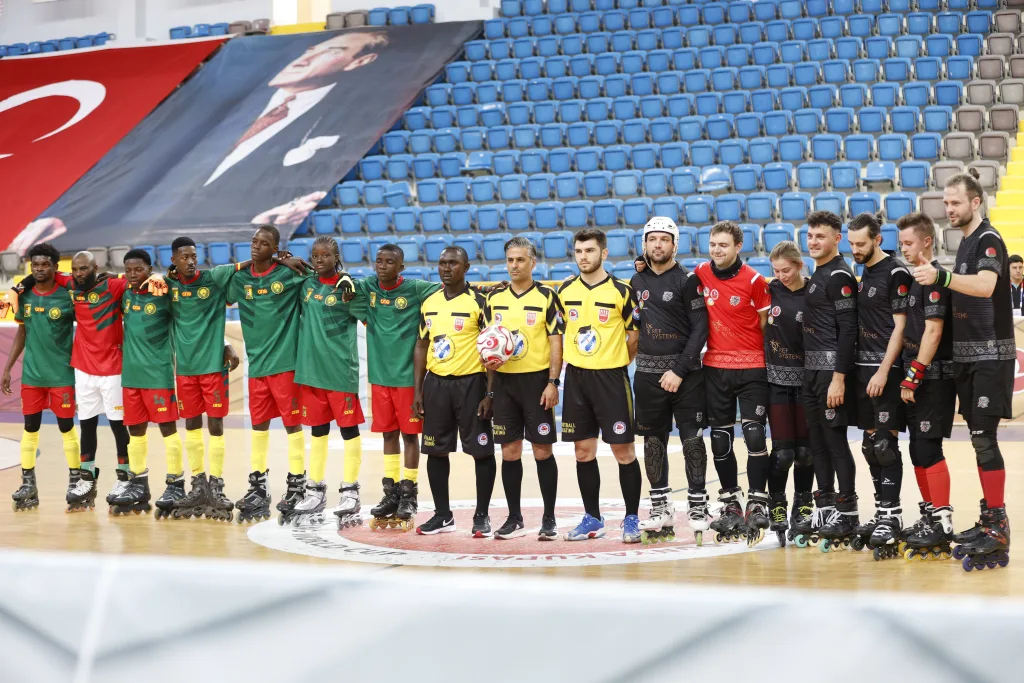 Two national teams and the match officials lined up before a World Cup match