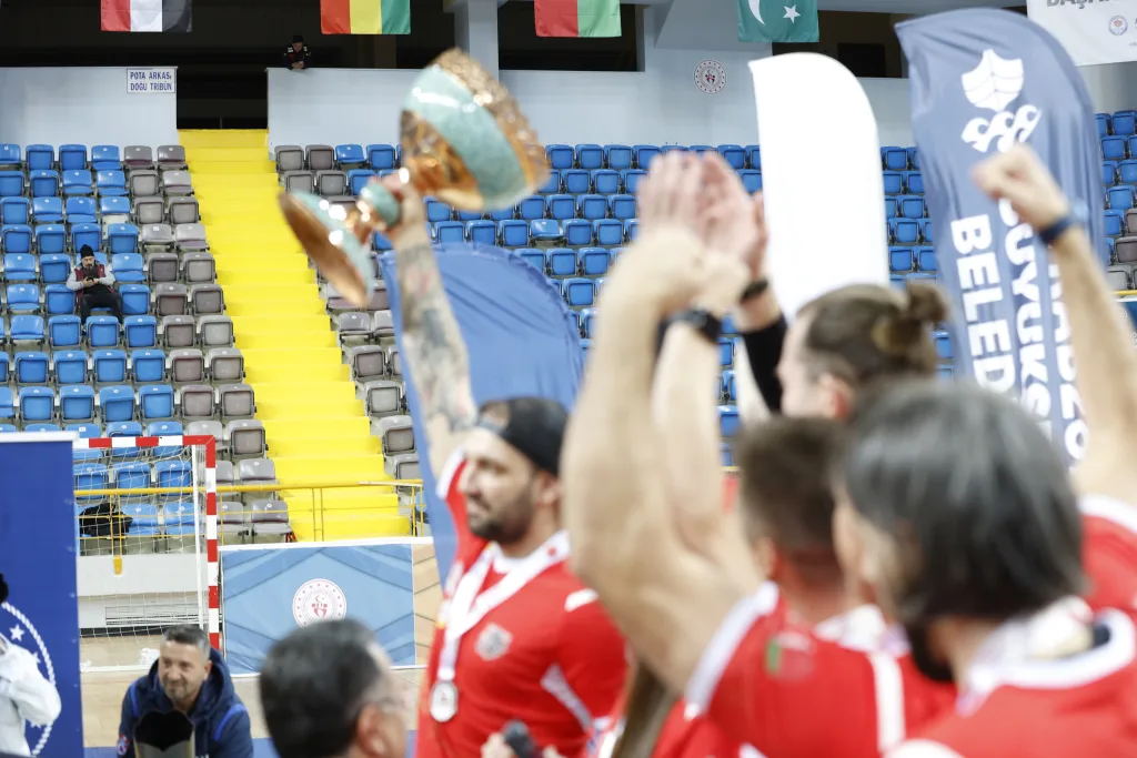Champions lifting the Football Skating World Cup trophy at the closing ceremony
