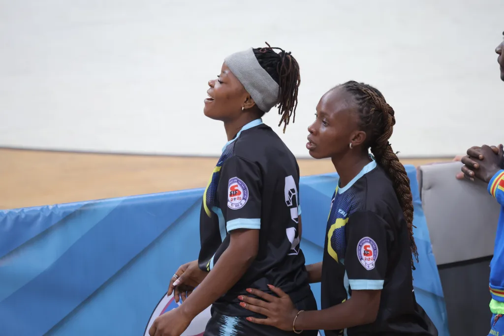 Two women players of the same national team together during an international tournament