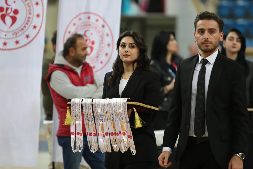 Officials carrying the medals of the Football Skating World Cup 2024 to the ceremony