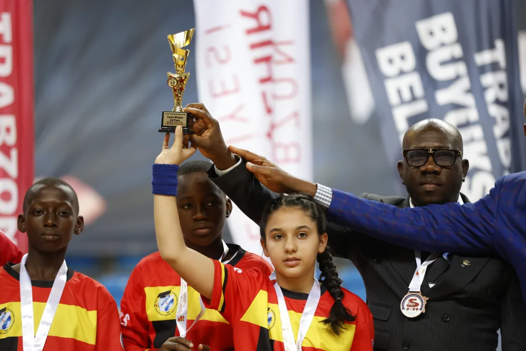Young Football Skating players holding their medals and trophy after an international final