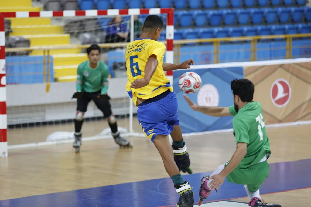 A Brazilian player attacking the goal during a Football Skating World Cup match