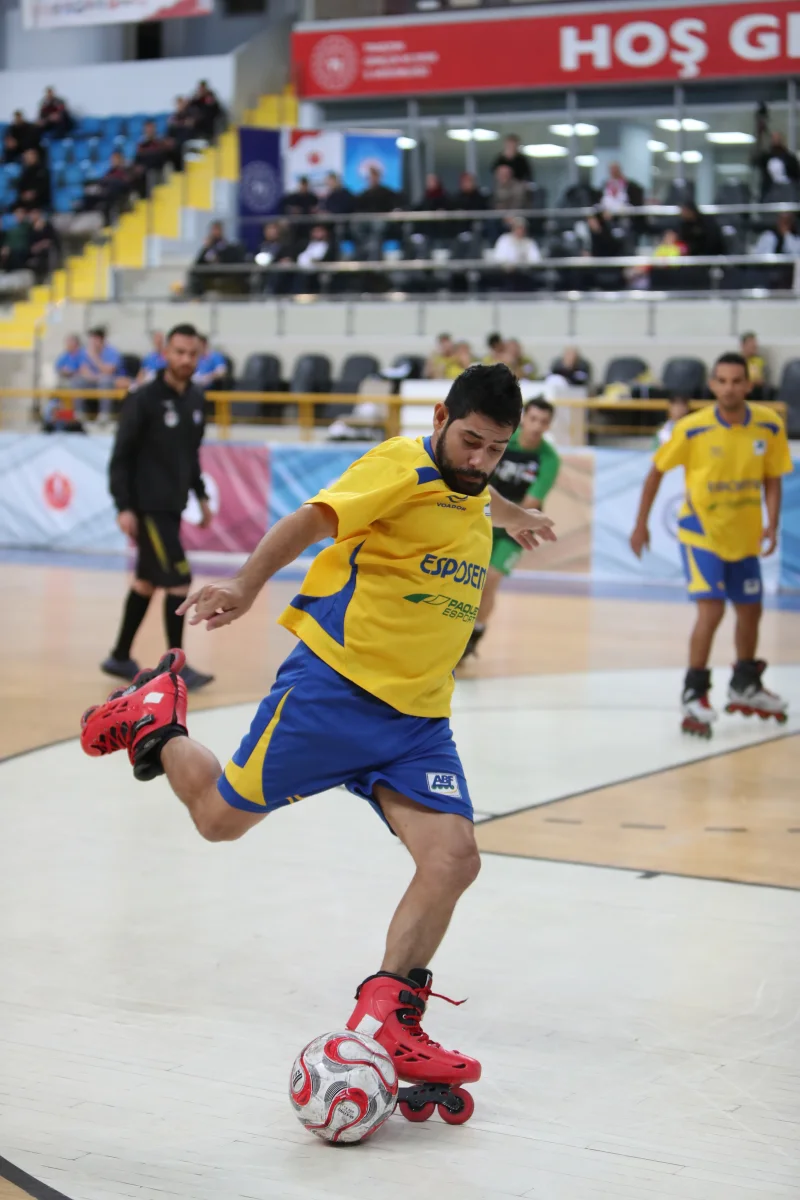 A Brazilian player controlling the ball on inline skates during international competition